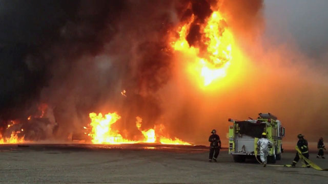 Watch: Firefighters use water jetpacks to put out flames