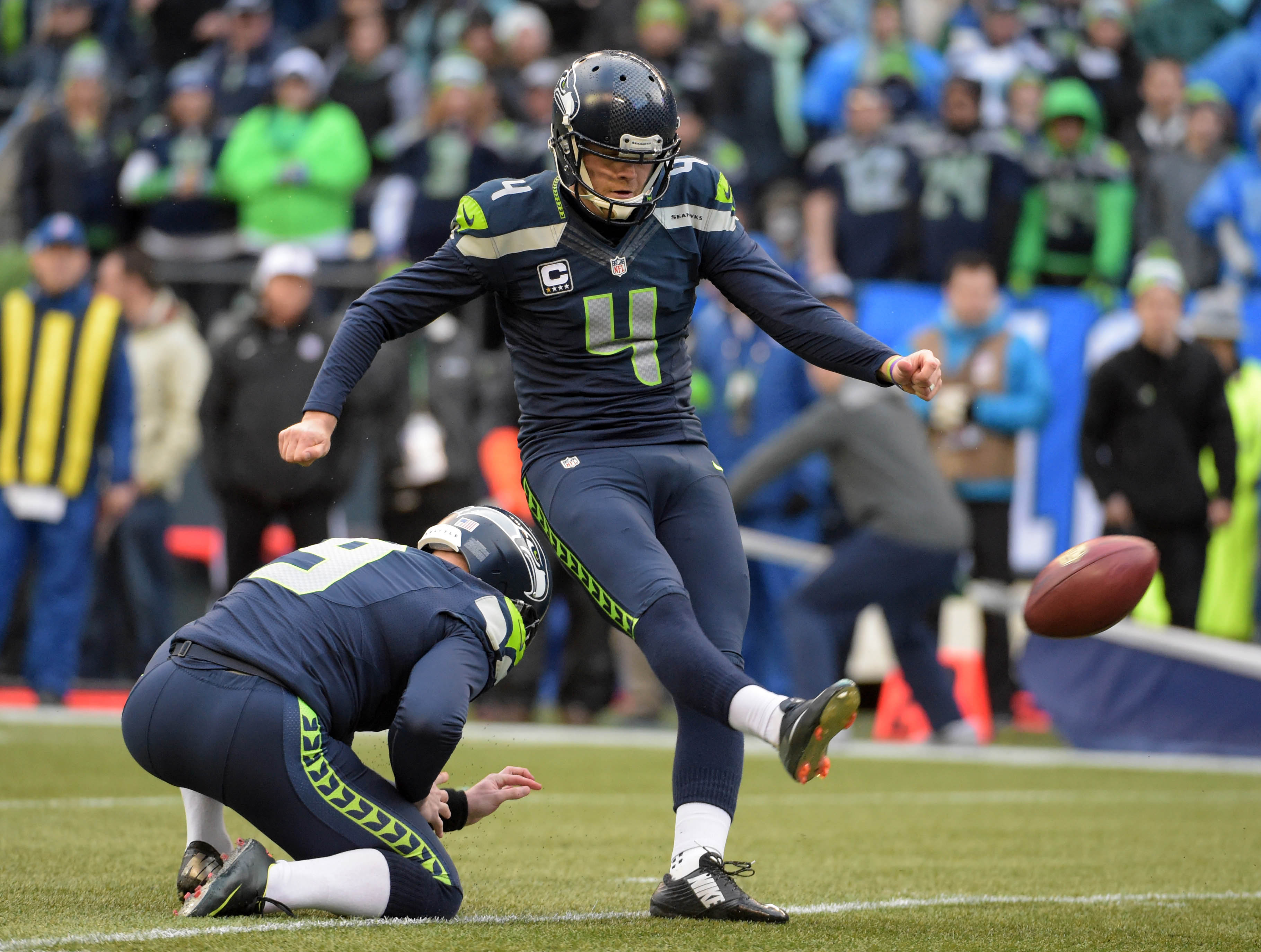 An NFL kicker's unique ball and shoes 