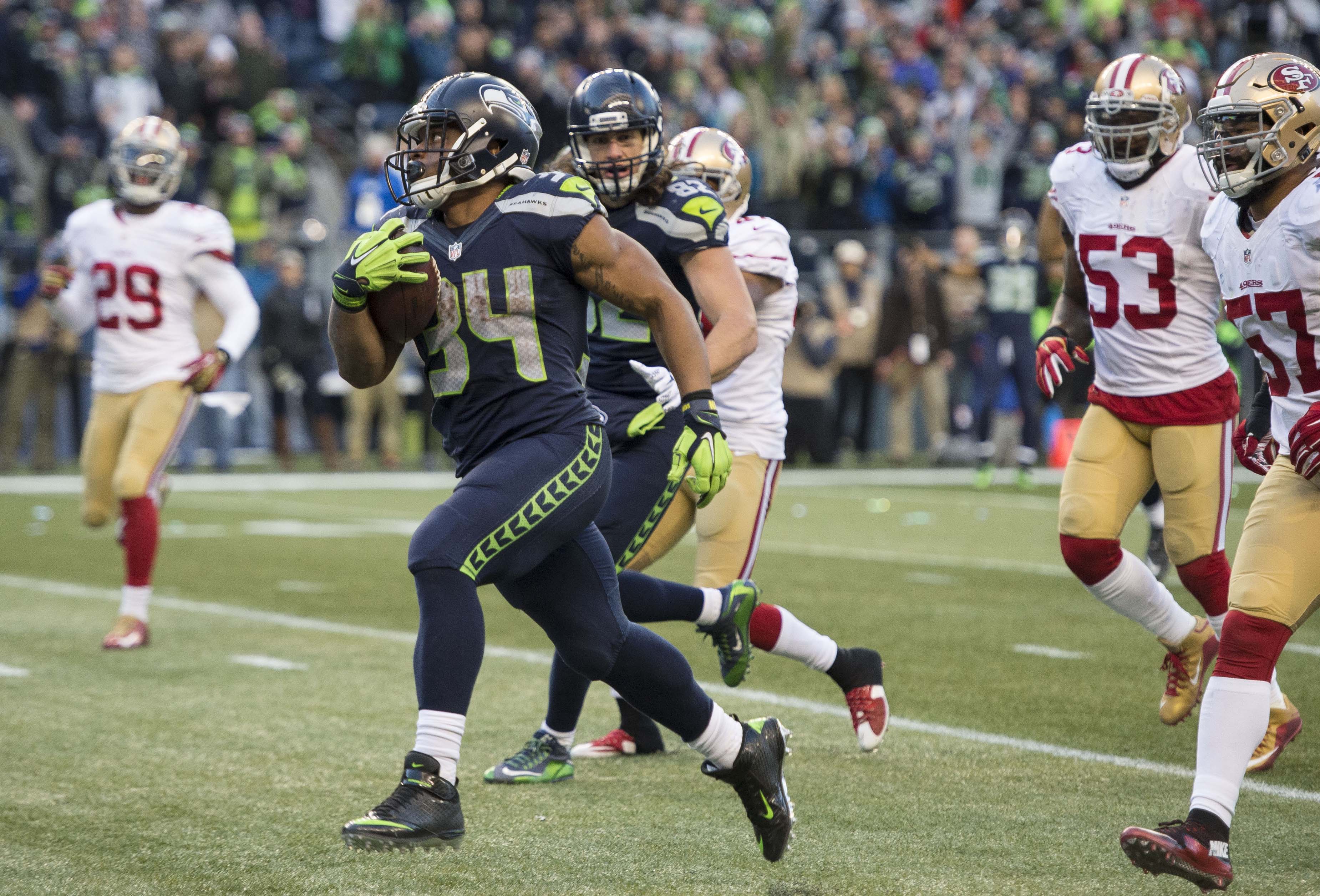 Running back Curt Warner of the Seattle Seahawks rushes for yards