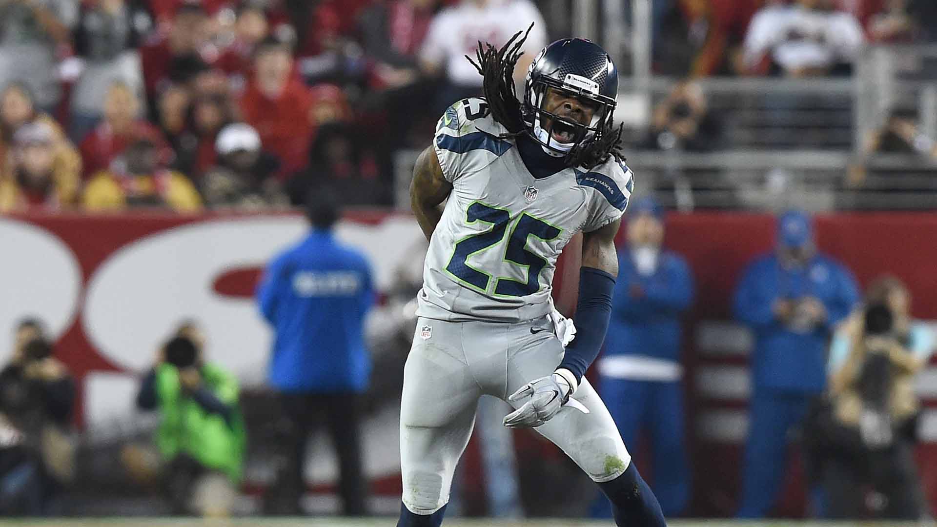 Seattle Seahawks head coach Pete Carroll talks things over with cornerback  Richard Sherman (25) while on the sidelines during the Super Bowl XLVIII at  MetLife Stadium in East Rutherford, New Jersey on