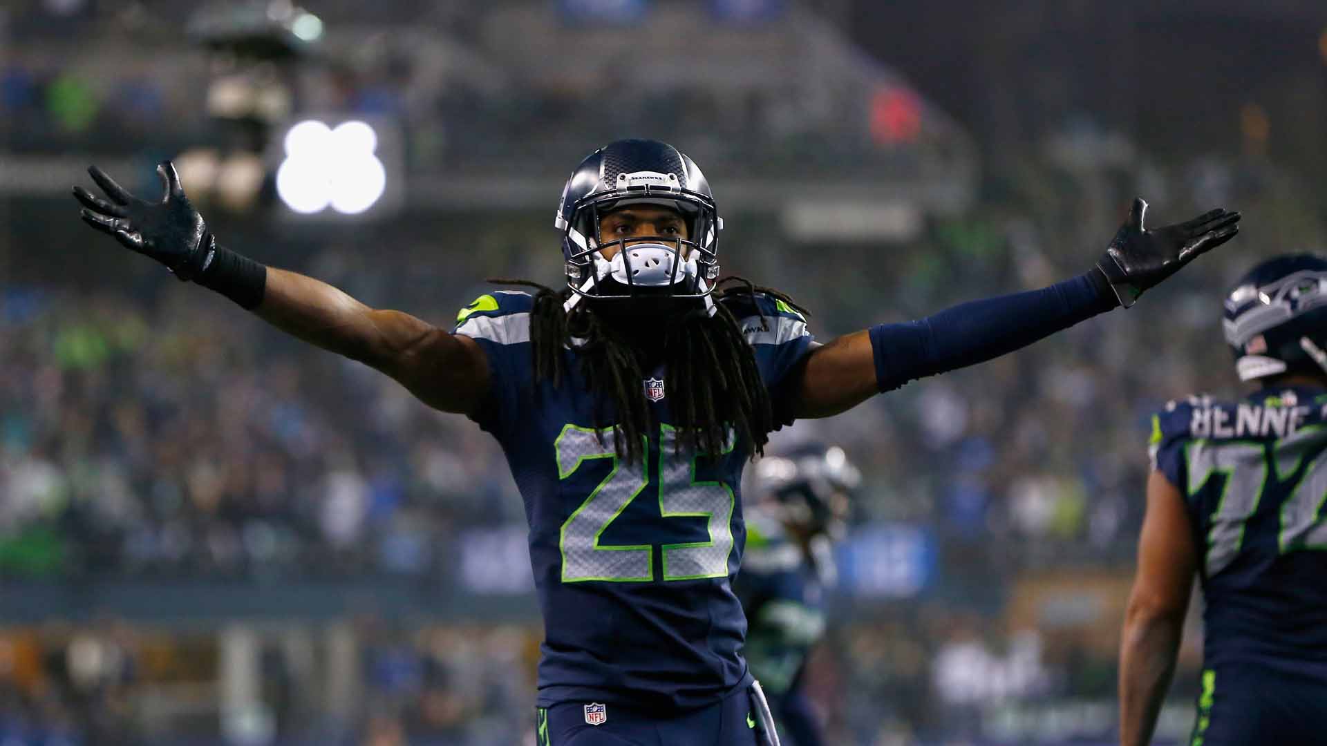 Seattle Seahawks head coach Pete Carroll talks things over with cornerback  Richard Sherman (25) while on the sidelines during the Super Bowl XLVIII at  MetLife Stadium in East Rutherford, New Jersey on