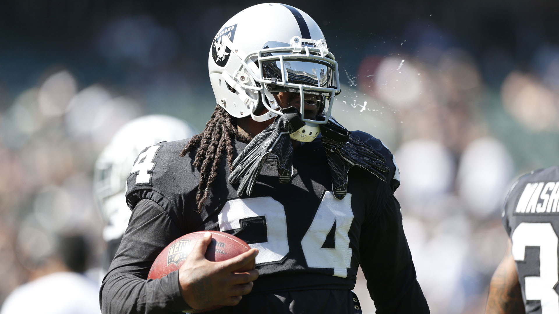 Marshawn Lynch sits during the national anthem - California Golden