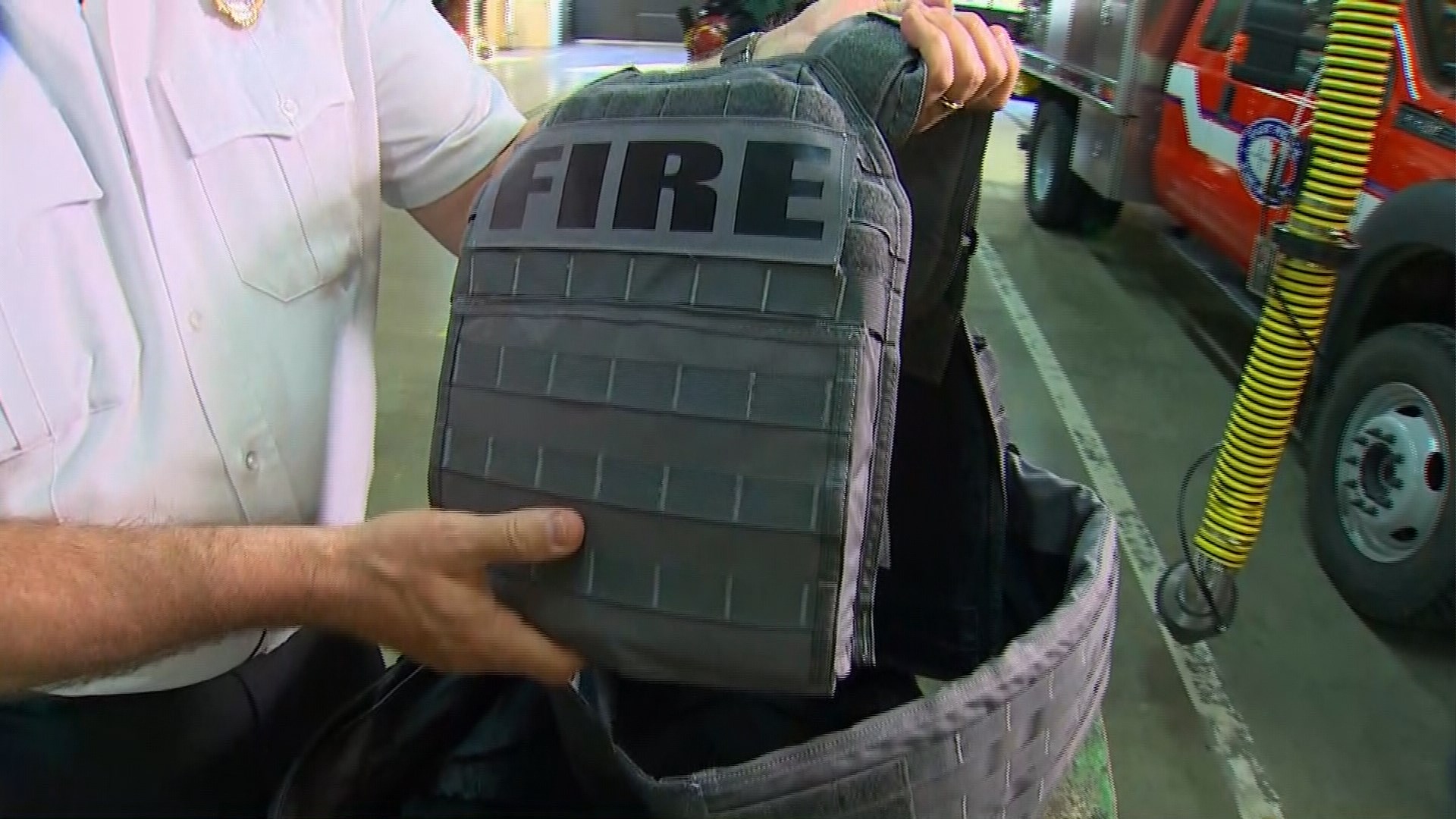 Local firefighters equipped with bulletproof vests